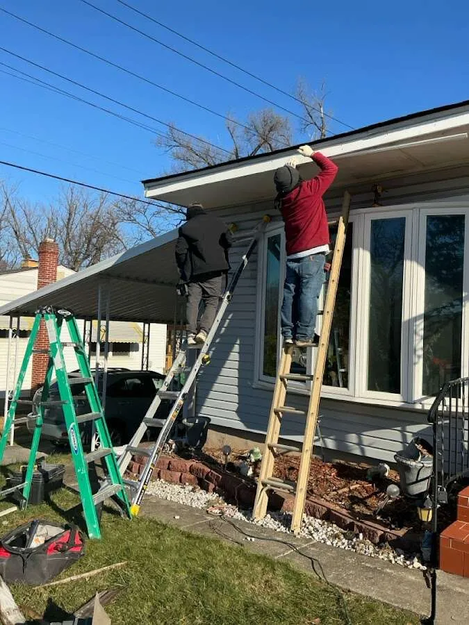 Restoration crew performing exterior repair in North Providence